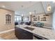 Open kitchen with large island, granite countertops, stainless steel appliances, and a view to the living space at 2001 Lincoln St # 2213, Denver, CO 80202