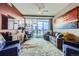 Bright living room with floor-to-ceiling windows, balcony and stunning city views, complete with cozy seating at 2001 Lincoln St # 2213, Denver, CO 80202