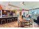 Open-concept living space with modern kitchen, dining area, and balcony access at 2001 Lincoln St # 2213, Denver, CO 80202