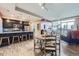 Open-concept living space featuring kitchen with breakfast bar, dining area and a large living room with city views at 2001 Lincoln St # 2213, Denver, CO 80202