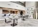 Modern lounge area with bar, tables, chairs, and elegant decor for residents and guests at 2001 Lincoln St # 2213, Denver, CO 80202