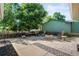 Backyard offers a patio area with mature trees, firepit, and plenty of seating at 7552 Nikau Dr, Niwot, CO 80503