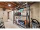 Unfinished basement area with metal shelving, exposed ceiling, and storage at 7552 Nikau Dr, Niwot, CO 80503