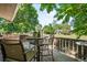 Charming deck area with table and chairs surrounded by trees and nature at 7552 Nikau Dr, Niwot, CO 80503