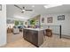 Kitchen with a center island, stainless appliances, and stylish backsplash with easy access to the living area at 7552 Nikau Dr, Niwot, CO 80503