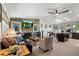 Sun-filled open-concept living area featuring a fireplace, skylights, and seamless access to the kitchen at 7552 Nikau Dr, Niwot, CO 80503