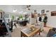 Bright and open living space with skylights, modern fan, and seamless flow to the well-equipped kitchen at 7552 Nikau Dr, Niwot, CO 80503