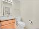 Bright half-bath features a classic vanity, toilet, and neutral decor at 3294 Sentinel Dr, Boulder, CO 80301