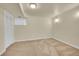Bright bedroom features neutral carpet, baseboards, and paint with a closet and small window at 3294 Sentinel Dr, Boulder, CO 80301