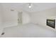 This bedroom has plush carpeting, a tiled fireplace, and doors to other rooms at 3294 Sentinel Dr, Boulder, CO 80301