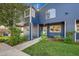 Exterior view of the home featuring blue siding, green space, and a concrete walkway at 3294 Sentinel Dr, Boulder, CO 80301