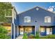 Exterior view of the blue siding, multi-Gathering home with covered entryway and manicured landscaping at 3294 Sentinel Dr, Boulder, CO 80301