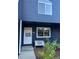 The exterior of this home features blue siding, a white front door, and charming bench seating at 3294 Sentinel Dr, Boulder, CO 80301