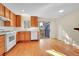 Spacious kitchen with wood cabinets, white appliances, and hardwood floors at 3294 Sentinel Dr, Boulder, CO 80301