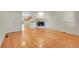 Open-concept living room with hardwood floors and a cozy fireplace at 3294 Sentinel Dr, Boulder, CO 80301