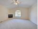 Large living room with a fireplace, large windows, and neutral carpet at 3294 Sentinel Dr, Boulder, CO 80301