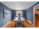 Elegant dining room with hardwood floors and contemporary lighting at 6918 E Long Ave, Centennial, CO 80112