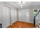 Bright foyer with hardwood floors, closet, and decorative front door with glass inlays at 6918 E Long Ave, Centennial, CO 80112