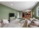 Spacious living area leading to the kitchen and dining area, perfect for entertaining and daily living at 6918 E Long Ave, Centennial, CO 80112