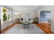 Bright living room with hardwood floors, neutral decor, and abundant natural light at 6918 E Long Ave, Centennial, CO 80112