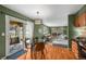 Open-concept living space with a dining area, fireplace, and access to a screened-in porch; great for entertaining at 6918 E Long Ave, Centennial, CO 80112
