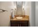 Powder room featuring a unique stone sink and vanity with updated lighting and fixtures at 7600 Landmark Way # 1215, Greenwood Village, CO 80111