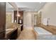 Modern bathroom with dual sinks, soaking tub, and walk-in shower at 7600 Landmark Way # 1215, Greenwood Village, CO 80111
