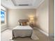 Inviting bedroom with a comfortable bed, stylish side table, and sun-filled window with city views at 7600 Landmark Way # 1215, Greenwood Village, CO 80111
