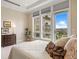 Bright bedroom featuring large windows with blinds, a decorative painting, and a chest of drawers at 7600 Landmark Way # 1215, Greenwood Village, CO 80111