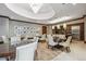 Elegant dining area with round tables, white chairs, and a chandelier at 7600 Landmark Way # 1215, Greenwood Village, CO 80111