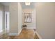 Hallway with tiled floor and contemporary decor, leading to various rooms in the residence at 7600 Landmark Way # 1215, Greenwood Village, CO 80111