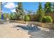 Community hot tub surrounded by lush landscaping and featuring stone accents at 7600 Landmark Way # 1215, Greenwood Village, CO 80111