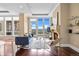 Bright living room with hardwood floors, a fireplace, and windows with an amazing view at 7600 Landmark Way # 1215, Greenwood Village, CO 80111