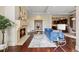 Spacious living area with hardwood floors, a fireplace, and easy access to the kitchen and office at 7600 Landmark Way # 1215, Greenwood Village, CO 80111