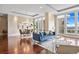 Bright open concept living area with dining area, city views, hardwood floors, and modern furniture at 7600 Landmark Way # 1215, Greenwood Village, CO 80111