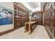 Charming wine cellar with wood storage, tile floors, and a tasting table at 7600 Landmark Way # 1215, Greenwood Village, CO 80111