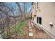 Exterior backyard view with a stone pathway leading along the side of the house at 2304 S Holly St # A, Denver, CO 80222