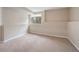 Finished basement area with carpeting, natural light from window, and neutral color palette at 2304 S Holly St # A, Denver, CO 80222