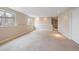 Spacious finished basement area with carpet and natural light at 2304 S Holly St # A, Denver, CO 80222