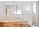Simple bathroom with single vanity and a shower, offering functionality at 2304 S Holly St # A, Denver, CO 80222