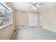 Neutral bedroom with carpeted floor, ceiling fan, and double door closet at 2304 S Holly St # A, Denver, CO 80222