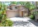 Charming two-story home featuring a covered front porch, attached garage, and well-maintained landscaping at 2304 S Holly St # A, Denver, CO 80222