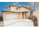Charming two-story home with an attached garage and covered front entry at 2304 S Holly St # A, Denver, CO 80222