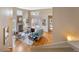 Open living room with hardwood floors, fireplace, and access to back deck at 2304 S Holly St # A, Denver, CO 80222