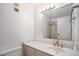 Bathroom featuring updated fixtures, a large mirror, and a shower at 1625 Larimer St # 1001, Denver, CO 80202