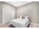 Bedroom has a walk-in closet with a full size bed with carpet throughout at 10066 Belvedere Cir, Lone Tree, CO 80124