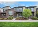 Charming two-story home with a modern design, professional landscaping, and welcoming walkway to the front door at 10066 Belvedere Cir, Lone Tree, CO 80124