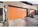 Spacious two car garage with an electric car charger and a newly sealed floor at 10066 Belvedere Cir, Lone Tree, CO 80124