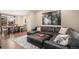 Cozy living room features a large sectional sofa, area rug, and decor at 10066 Belvedere Cir, Lone Tree, CO 80124