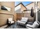 Outdoor patio is furnished with outdoor chairs and a table with an umbrella at 10066 Belvedere Cir, Lone Tree, CO 80124